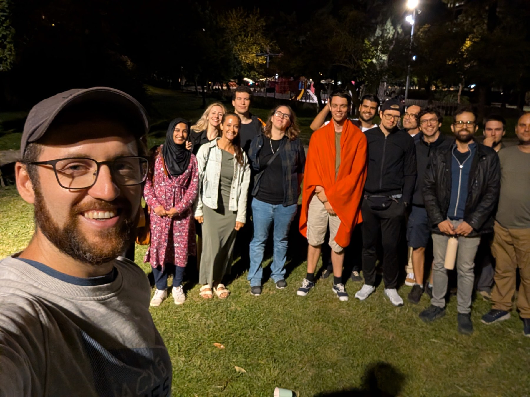 Community members meeting in the park in the evening
